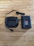 Rubbermaid 2173664 Battery 60 Volt Lithium Ion 4AH / Charger With Two Bags Open. Price: $70.00.