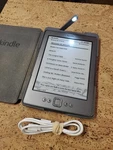 Kindle 4TH Gen Wi-fi Grey 6" E-book Bundled With Amazon Lighted Leather Case Used. Price: $49.91.